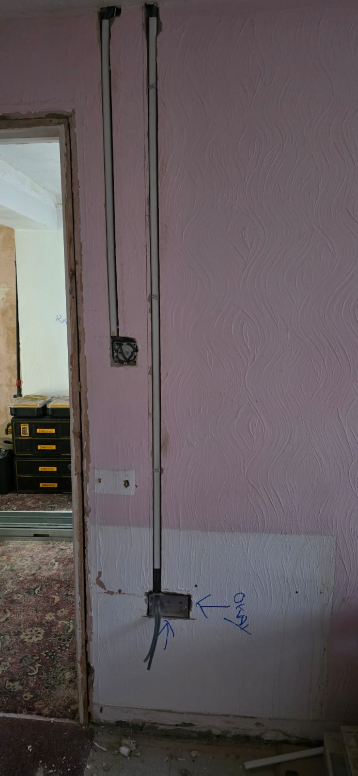 Conduit installed in wall during house rewire project