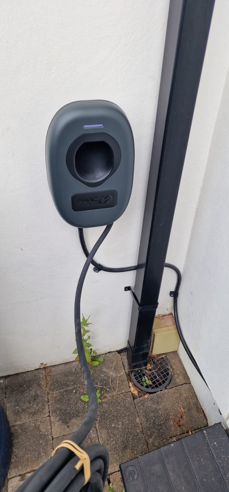 EV charger installed on a garage wall in Cardiff