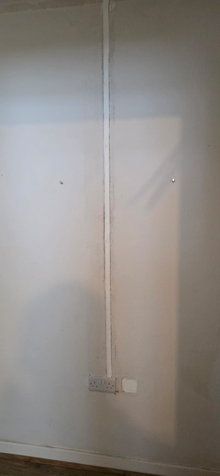 Neatly chased socket installation during a rewire in Cardiff